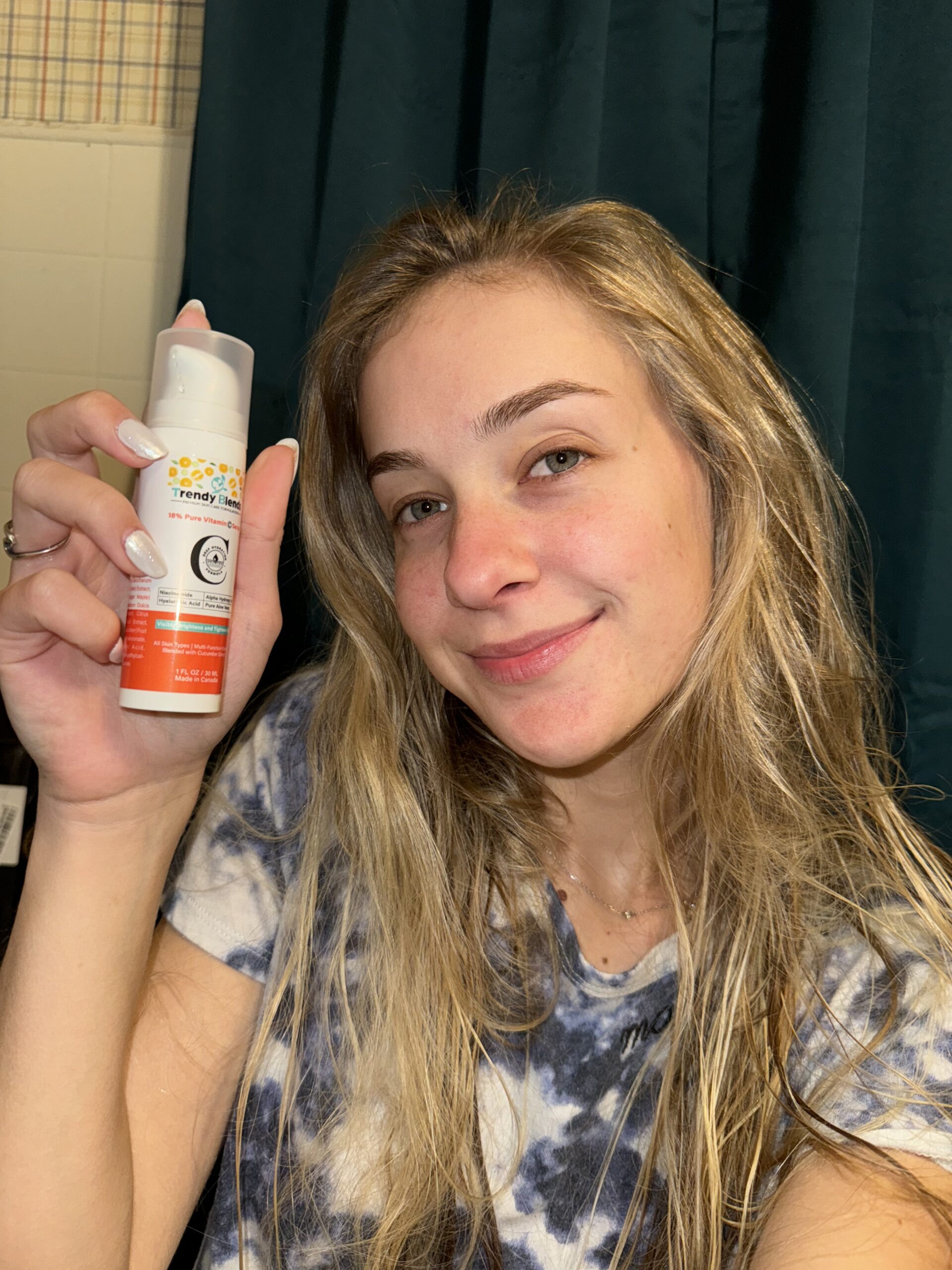 A close-up view of Trendy Blends 18% Pure Vitamin C Serum bottle showing the professional airless pump packaging for skin brightening.